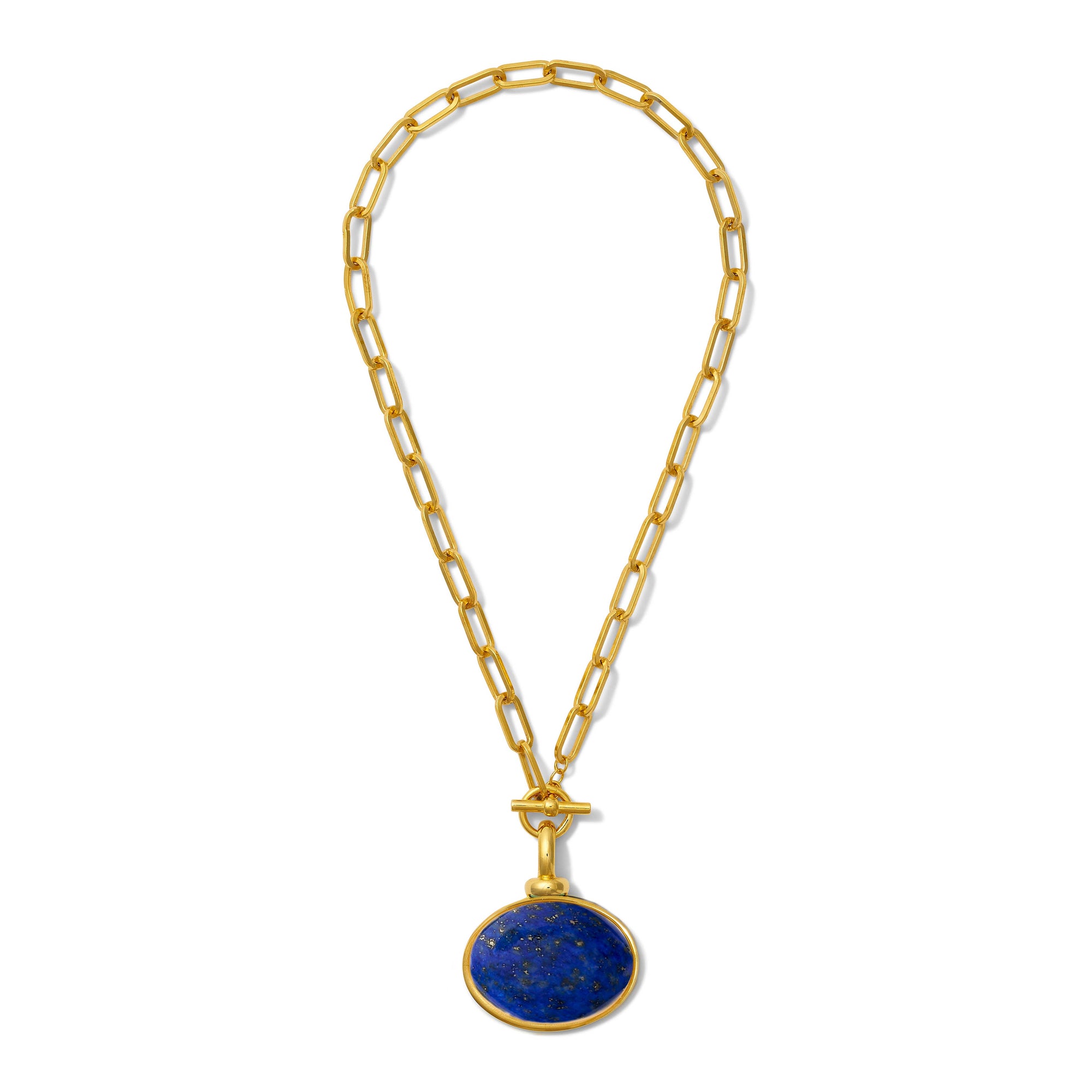 The Diana V. Pendant Necklace features a gold chain link design with elongated links, highlighting a round, deep blue lapis lazuli pendant. This pendant is encased in a gold bezel and the necklace is secured with a T-bar toggle clasp, enhancing its sophisticated and luxurious appeal.