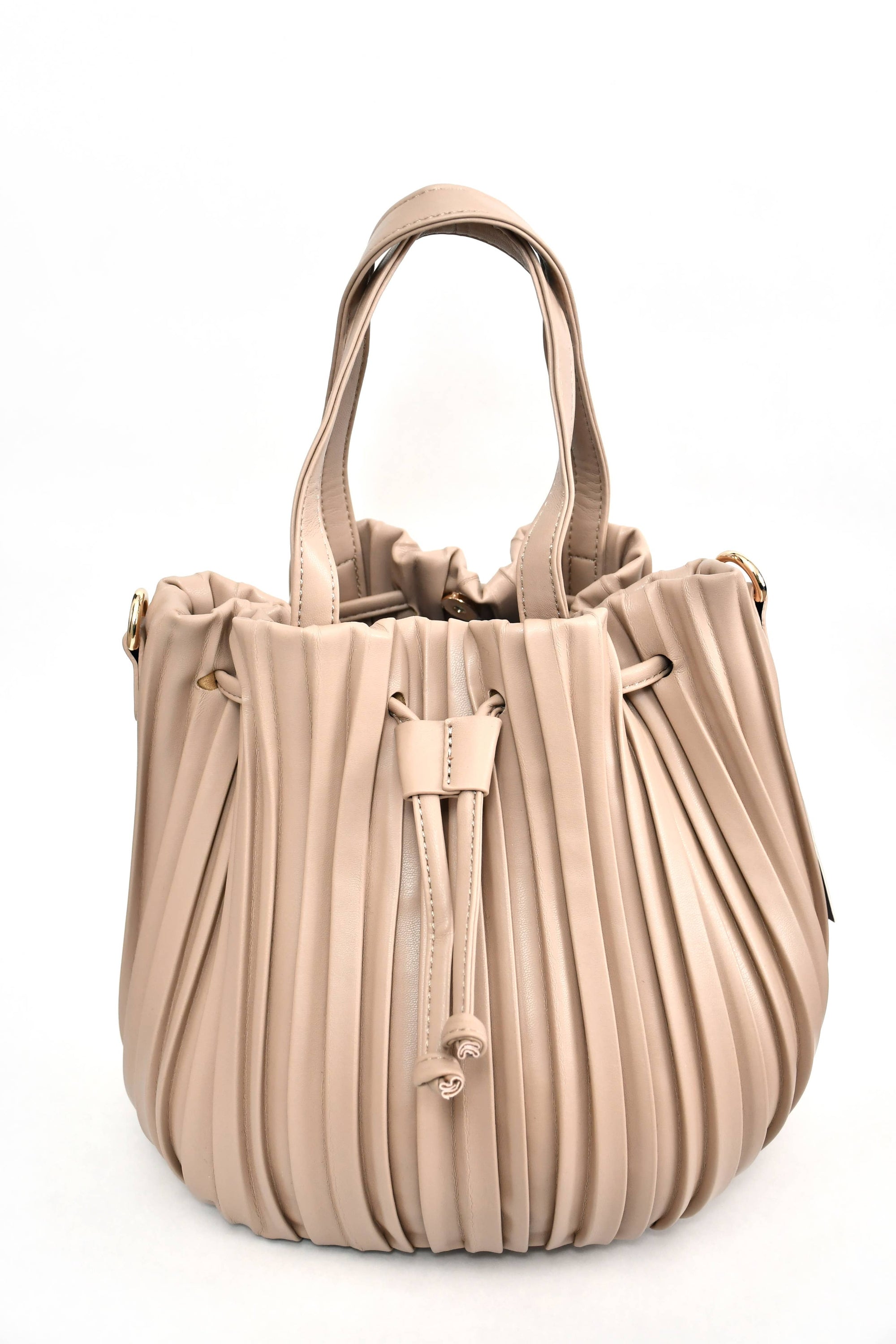 The Pleated Bucket Bag, a beige leather handbag with pleats and a drawstring closure, features two handles and is showcased against a plain white background. Accented with gold-tone hardware and boasting a smooth finish, this elegant and modern bag is perfect for any occasion.