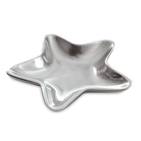 The Aluminum Star Tray, featuring smooth and reflective surfaces with five shining points, offers an elegant and contemporary appearance. Its subtle curve adds to its stylish design. Positioned on a white background to accentuate its metallic finish, this food-safe tray is perfect for display purposes but should be hand washed.