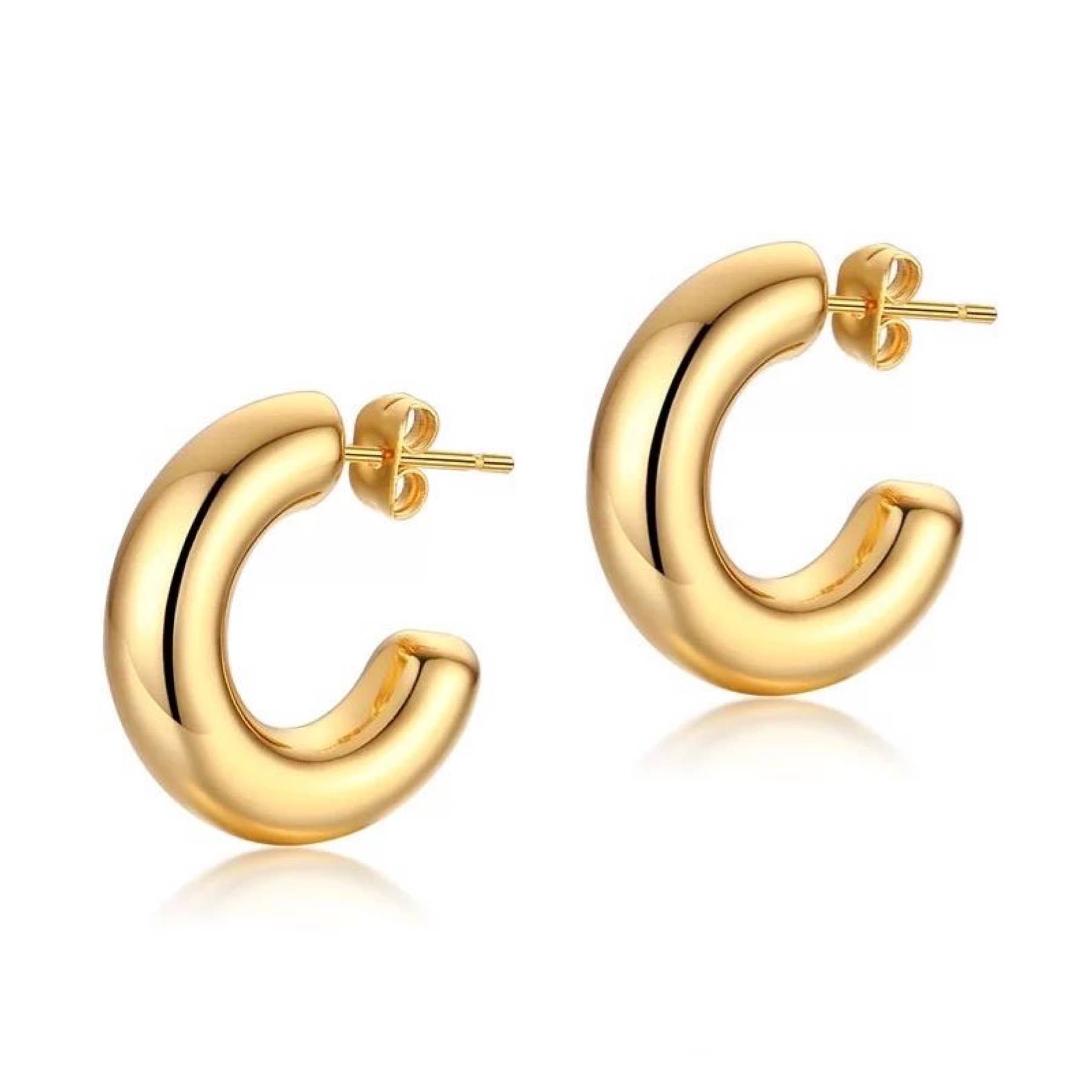 Introducing the Chloe Mini Hoop: a stunning pair of 18k gold-plated earrings featuring a shiny, smooth finish. Each small hoop is designed in the shape of a thick, curved "C" and includes a post backing for secure wear. The tarnish-resistant surface enhances their metallic luster, offering an elegant and stylish appearance.