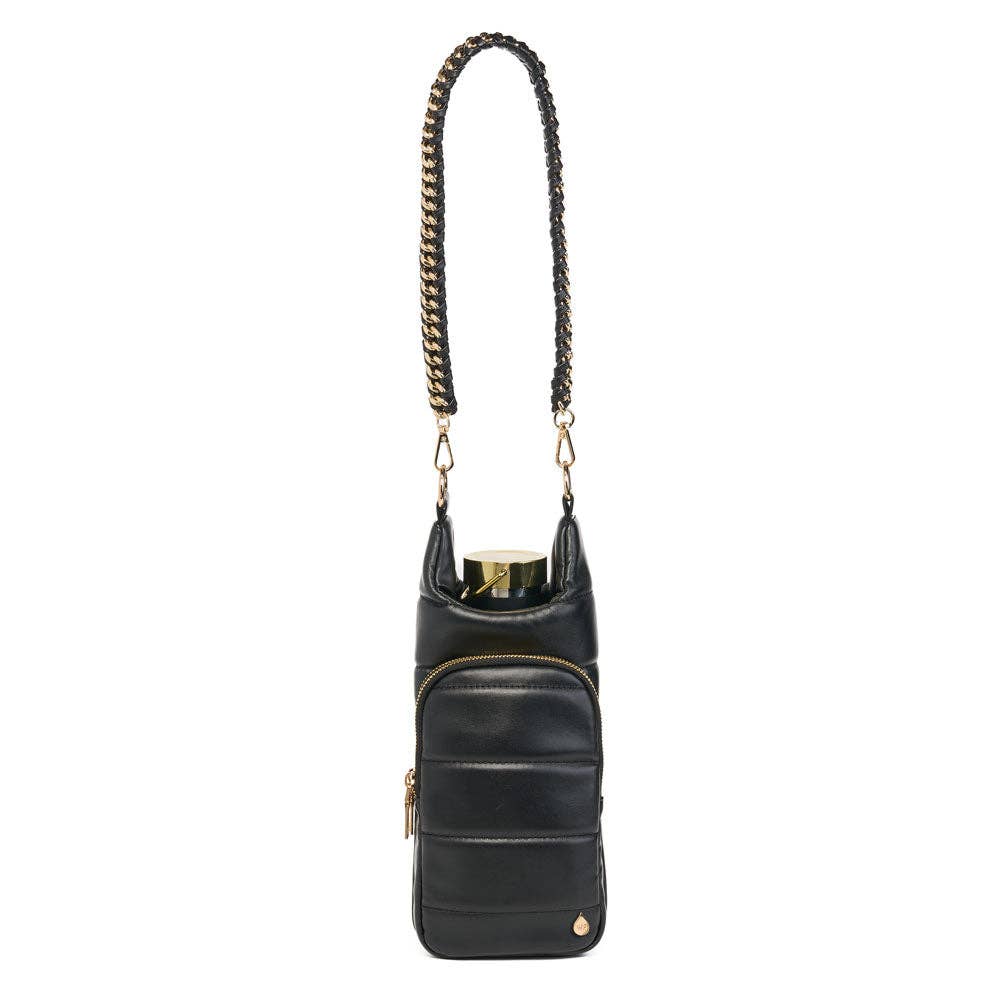 The Vegan Leather HydroBag® with Strap Bundle is an insulated wine purse featuring a chic quilted design and elegant gold zippers and accents. It comes with a gold-chain strap interwoven with black vegan leather for convenient hands-free wear, designed to carry a wine bottle upright while offering both functionality and style.