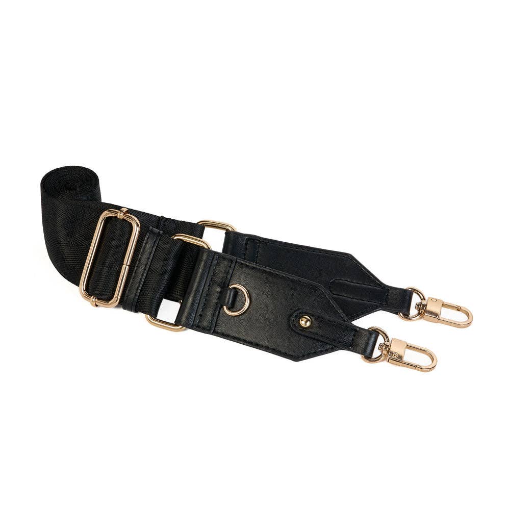 The Vegan Leather HydroBag® with Strap Bundle includes a black vegan leather shoulder strap that is adjustable for hands-free comfort. It features gold-tone hardware, such as swivel clasps and D-rings, adding to its versatility and style. This strap neatly rolls up beside the clasps, showcasing a smooth and durable texture that complements your HydroBag®.