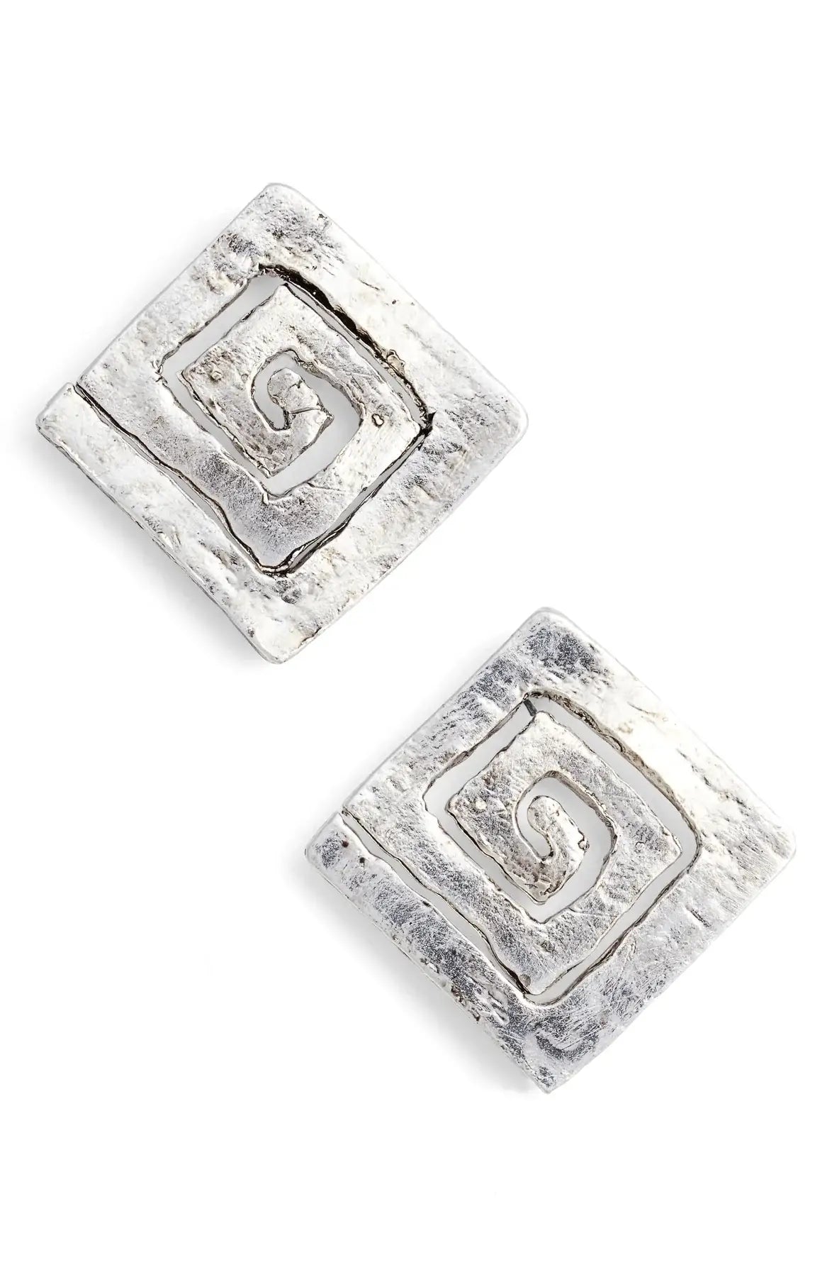 Close-up of a pair of Modern Square Spiral Stud Earrings with a textured silver surface. Each earring showcases a spiral design within the square, offering a layered, rustic appearance accentuated by an antique gold finish. Positioned at an angle, they enhance the three-dimensional effect of the spiral motif.