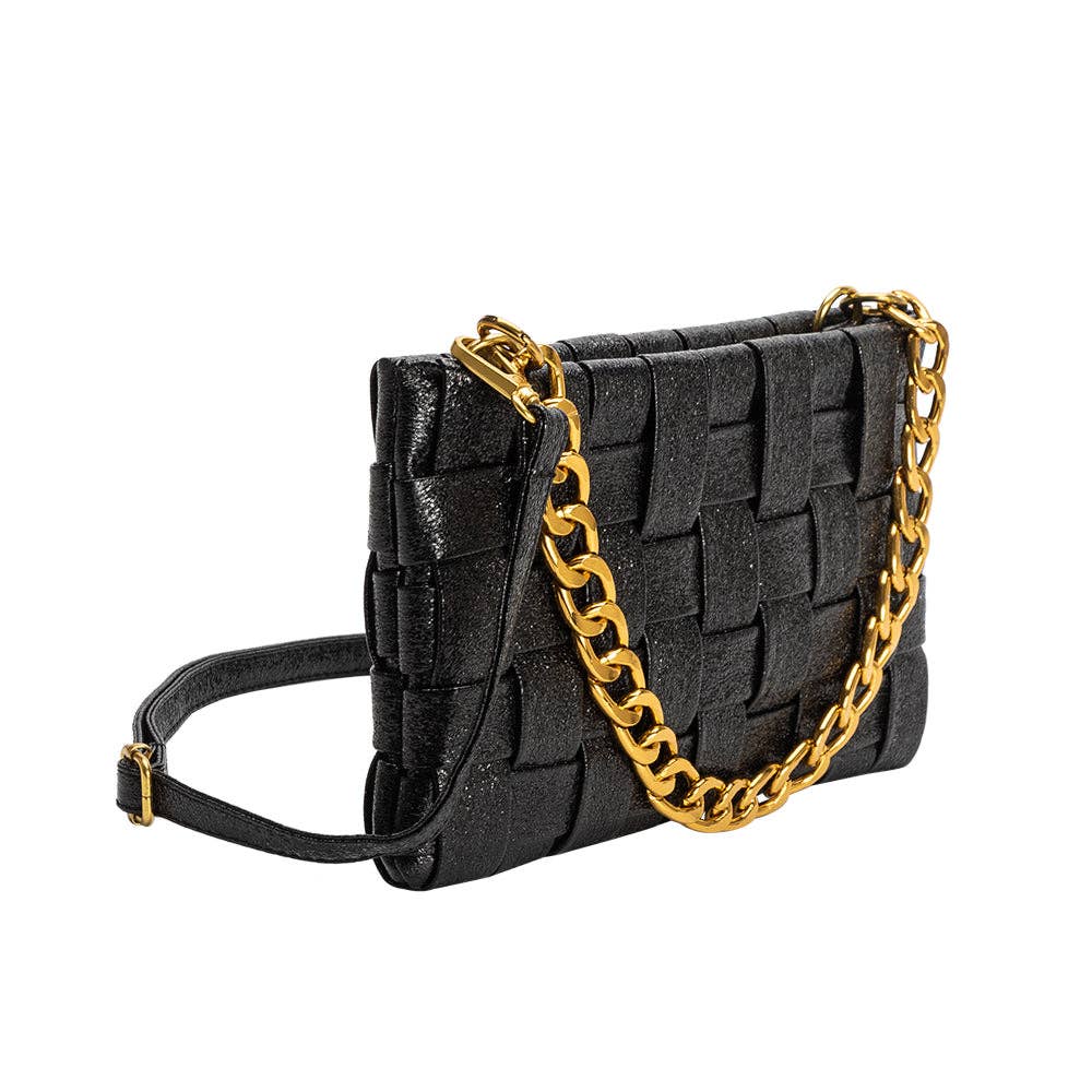 The Mimie Recycled Vegan Crossbody Bag is a stylish black handbag with a chic basket-weave pattern and a luxurious gold chain strap. It features a textured leather surface and includes an additional black strap for versatility, complemented by elegant gold-tone hardware.