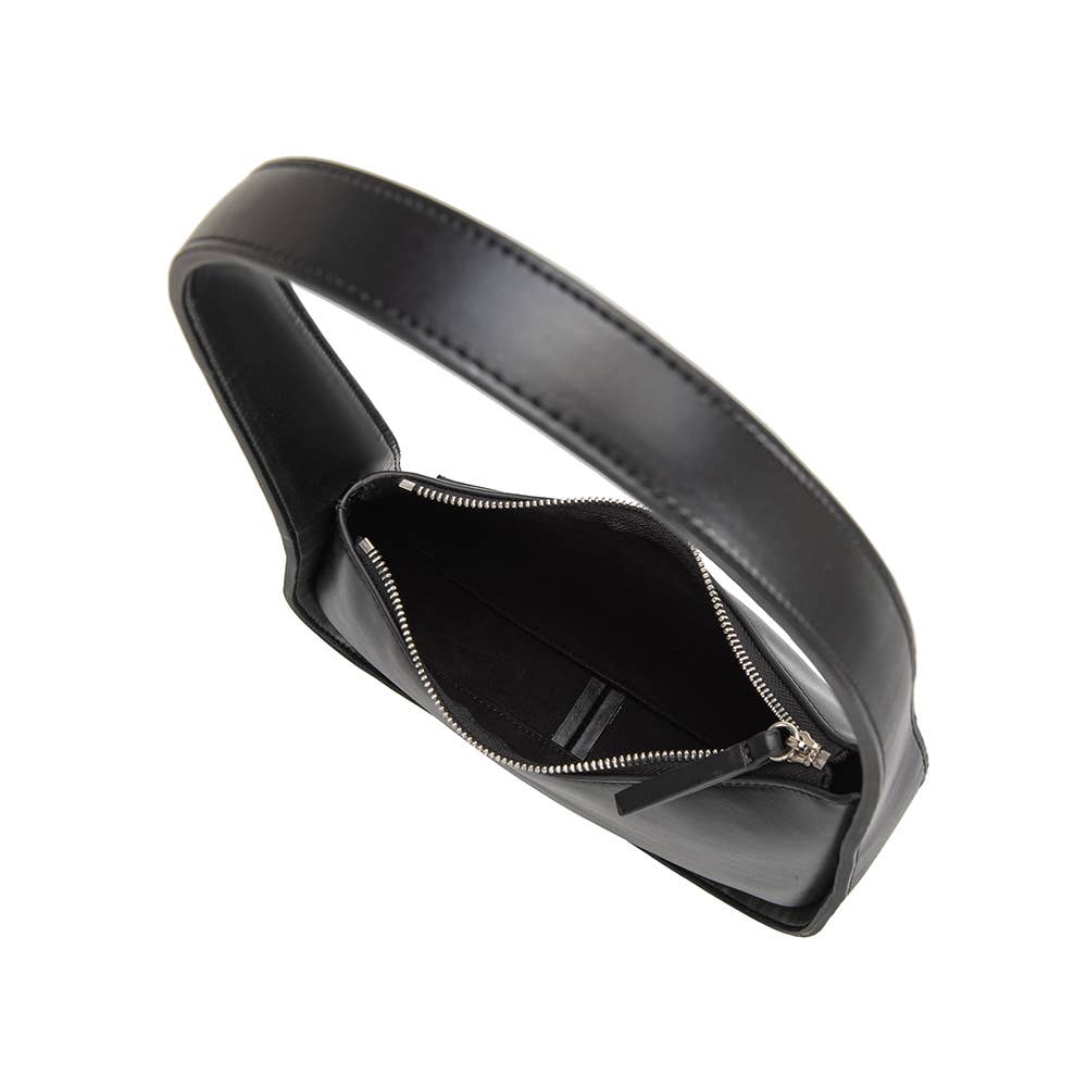 The Willow Recycled Vegan Shoulder Bag, shown open from a top angle, is crafted from black vegan leather and doubles as a shoulder bag. It features a wide handle with a silver-colored zipper closure. The interior reveals a spacious compartment lined in black fabric, made from recycled materials.