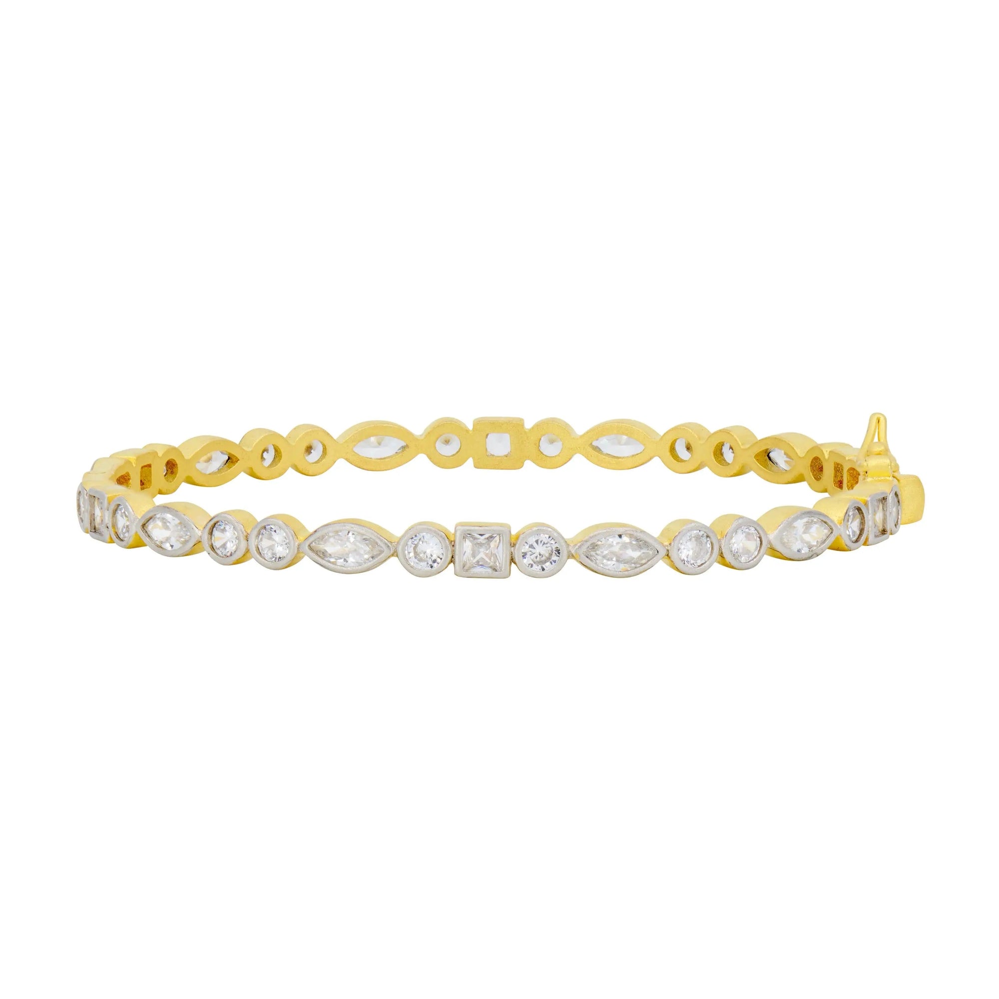 The Signature Mixed Shape Bangle is crafted in 14K gold and boasts a pattern of alternating oval and marquise-shaped crystal settings, highlighted by a single square crystal at its center. Its sleek design showcases intricate, curved links embellished with cubic zirconia stones, epitomizing a luxurious and refined style.