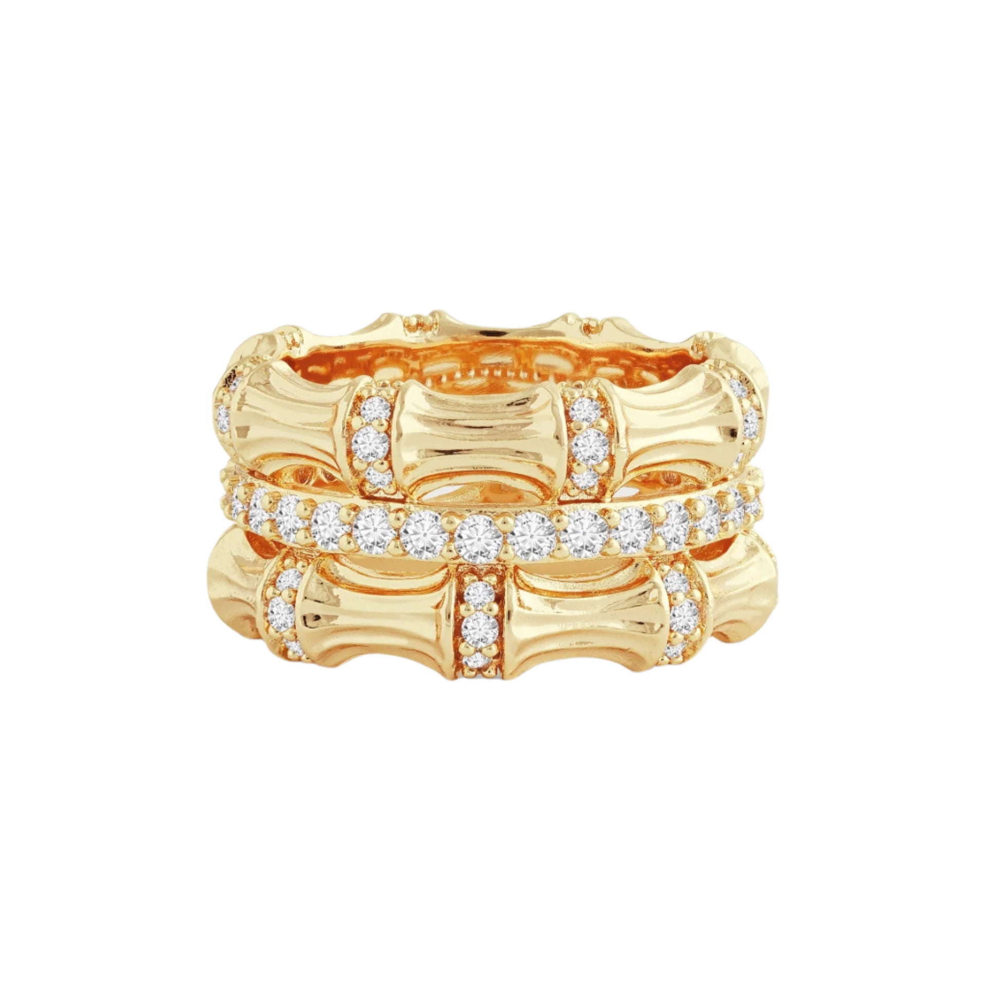 Introducing the Bamboo Stack Ring: an 18k gold piece featuring a bamboo-inspired design with two intertwined bands. These bands are gracefully embellished with pavé crystals that shimmer delicately across the top half, set against a simple, light gray backdrop.