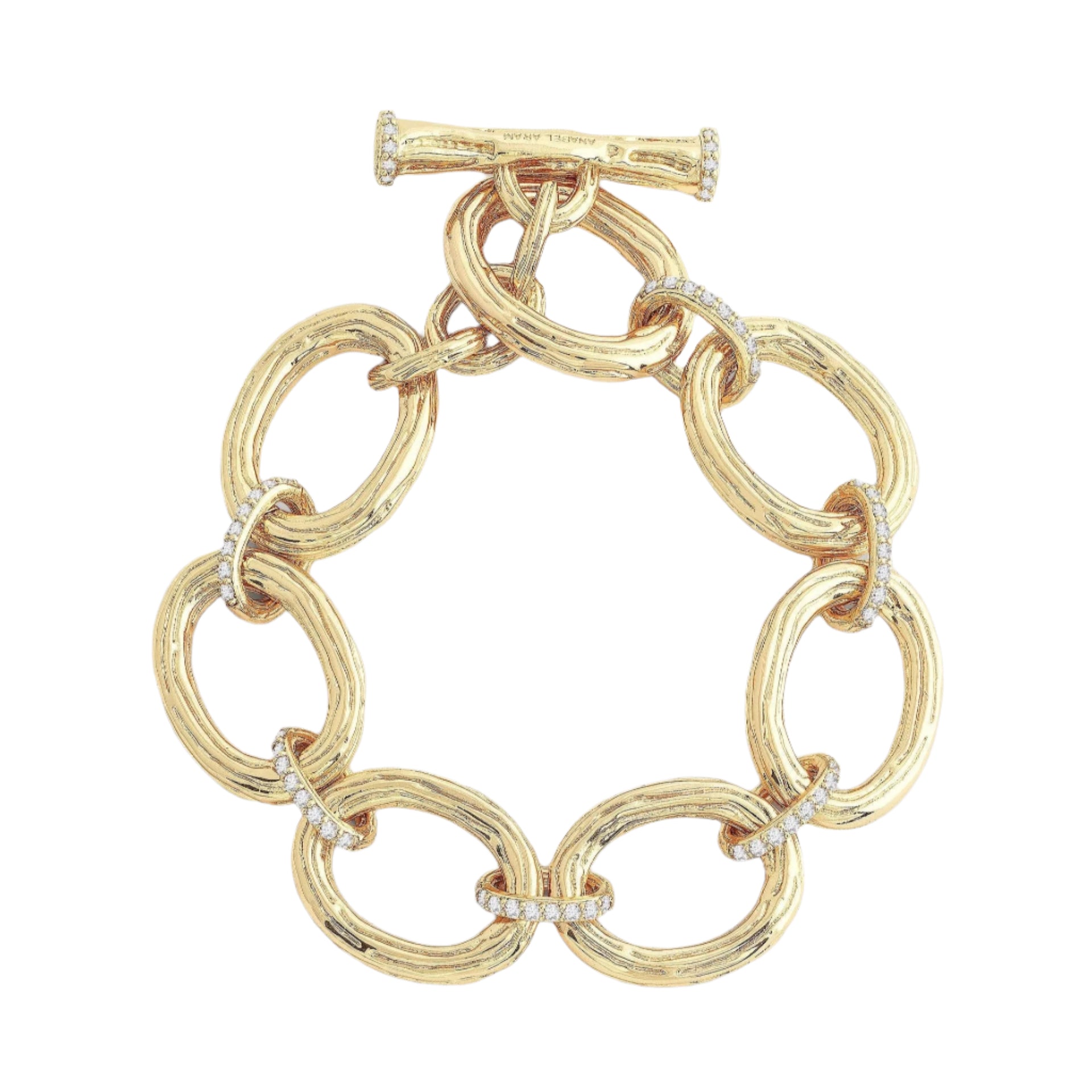 Introducing the Enchanted Forest Chain Bracelet, crafted with a gold-dipped brass chain featuring large, oval links seamlessly connected by smaller, textured rings. This bracelet is elegantly finished with a toggle clasp and includes delicate decorative details like hand-set crystals placed at intervals. Its shiny finish lends it an elegant and luxurious appearance when set against a plain background.
