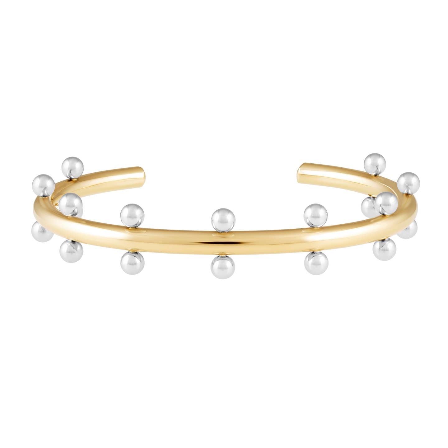 The Cindy Studded Cuff is a hypoallergenic, open-ended bracelet featuring evenly spaced silver spheres along its outer edge. Its polished 18k gold-plated surface contrasts beautifully with the shiny silver spheres, resulting in a modern and elegant design.