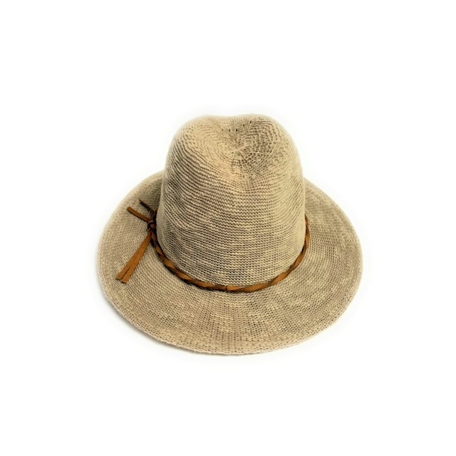 The Fedora Hat is beige, featuring a wide brim with soft suede trim around the crown's base. Its woven texture adds a rustic, casual look while offering SPF 50+ protection. Displayed on a plain white background, it's perfect for sunny days.