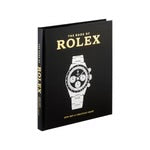 The cover of "The Book of Rolex" features a sleek black background adorned with an intricate white depiction of a luxury Rolex watch at its center. The book's title is prominently displayed in bold yellow lettering at the top, accompanied by smaller yellow text beneath it. The spine equally highlights the title prominently.