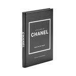 The product is a black hardcover edition called "Little Book of Chanel," authored by Emma Baxter-Wright. Its cover features an elegant minimalist design, accentuated by a thin white border and striking, bold white typography that evokes the timeless elegance of the iconic little black dress. The spine showcases the title and author's name standing out against a crisp white background.