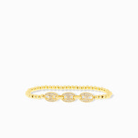 The Pave Anchor Link Stretch Beaded Bracelet showcases small gold round beads and three center oval designs adorned with sparkling white stones, elegantly linked in an anchor pattern against a plain white background to accentuate its dazzling details.