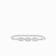 The Pave Anchor Link Stretch Beaded Bracelet combines small round beads with three larger oval, crystal-encrusted decorations. Its symmetrical elegance is accentuated by subtle anchor links, all set against a plain white background.