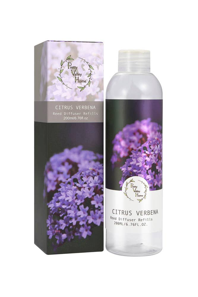 The "Diffuser Refill Oil" from Pretty Valley Home features a clear plastic bottle with a white cap, packaged in a box adorned with images of purple verbena flowers and labeled as "Citrus Verbena Reed Diffuser Refills." It contains 200ml (6.76 fl. oz.) of oil, providing a refreshing citrus verbena scent.