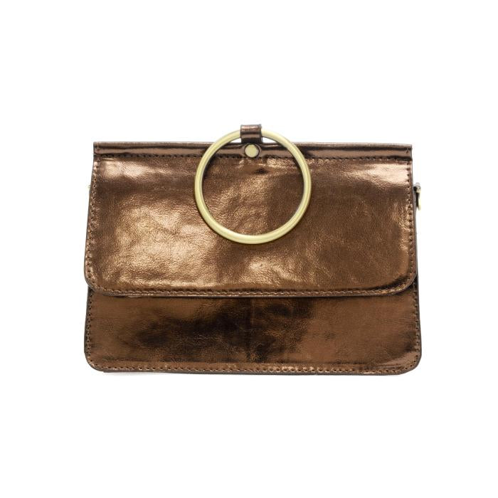 Introducing the Aria Ring Bag - Fall/Winter, a compact and elegant accessory crafted from smooth vegan leather in a shimmering metallic bronze hue. This versatile bracelet bag showcases clean, minimalistic lines and is adorned with a striking large circular gold ring on the front flap, serving as both an eye-catching decorative feature and a functional handle.