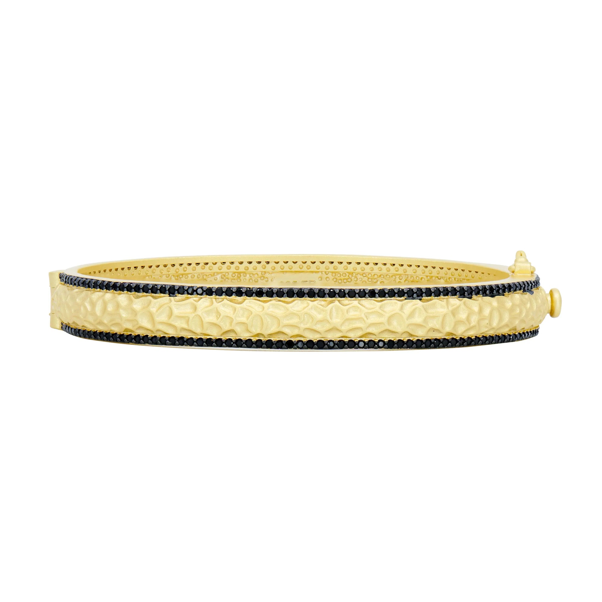 The Industrial Finish Textured Hinge Bracelet showcases a gold bangle design with a striking textured, industrial finish, beautifully framed by two rows of small black gemstones. Its clasp features a unique button-like fastener that adds a touch of intrigue. Crafted from sterling silver, this sophisticated piece combines contrasting colors for an elegant appearance.