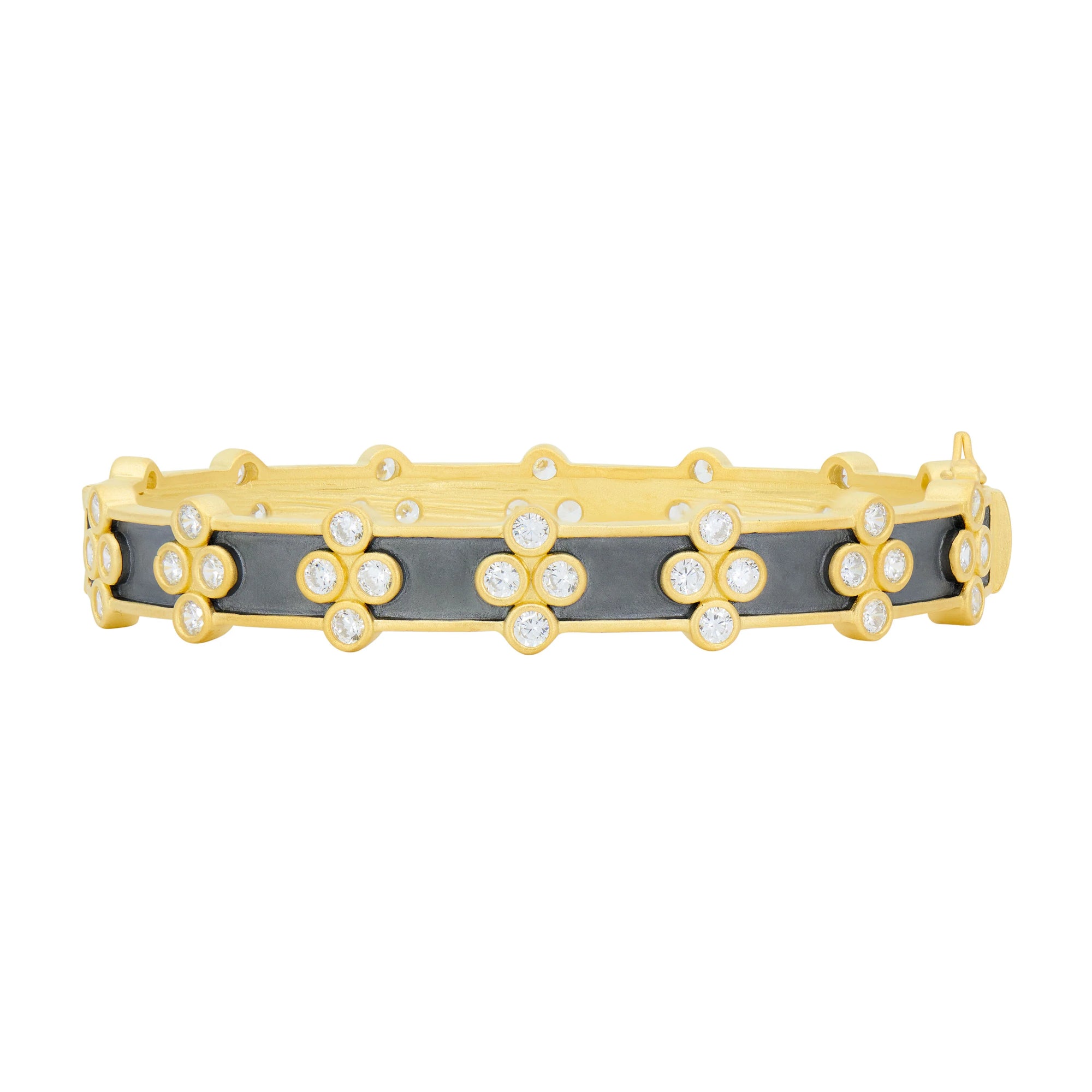 The Signature Brooklyn in Bloom Clover Hinge Bangle showcases a floral design with small flowers adorned with diamonds and cubic zirconia stones set against a black enamel backdrop. Each flower features a diamond center, while the gold edges and detailing enhance its luxurious appeal, complemented by its convenient clasp closure.