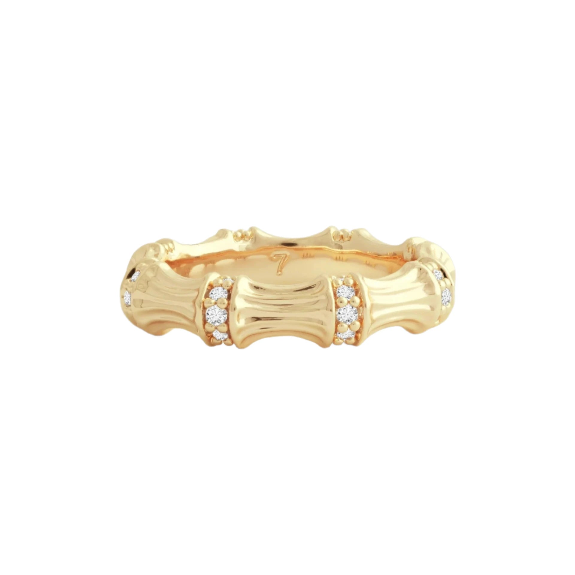 The Bamboo Single Ring, crafted in 18k gold, showcases a textured bamboo segment design. Each segment is adorned with tiny clusters of pavé crystals, beautifully highlighted against a light gray background to enhance its intricate details and elegant shine.