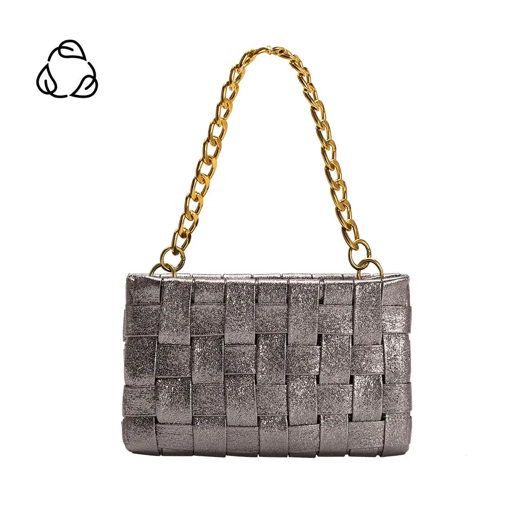 The Mimie Recycled Vegan Crossbody Bag is a silver woven handbag made from recycled vegan leather. It showcases a textured rectangular design, gold-tone hardware, and a chain strap. The interlaced material forms a grid-like pattern on a white background with a recycling symbol for its eco-friendly essence.