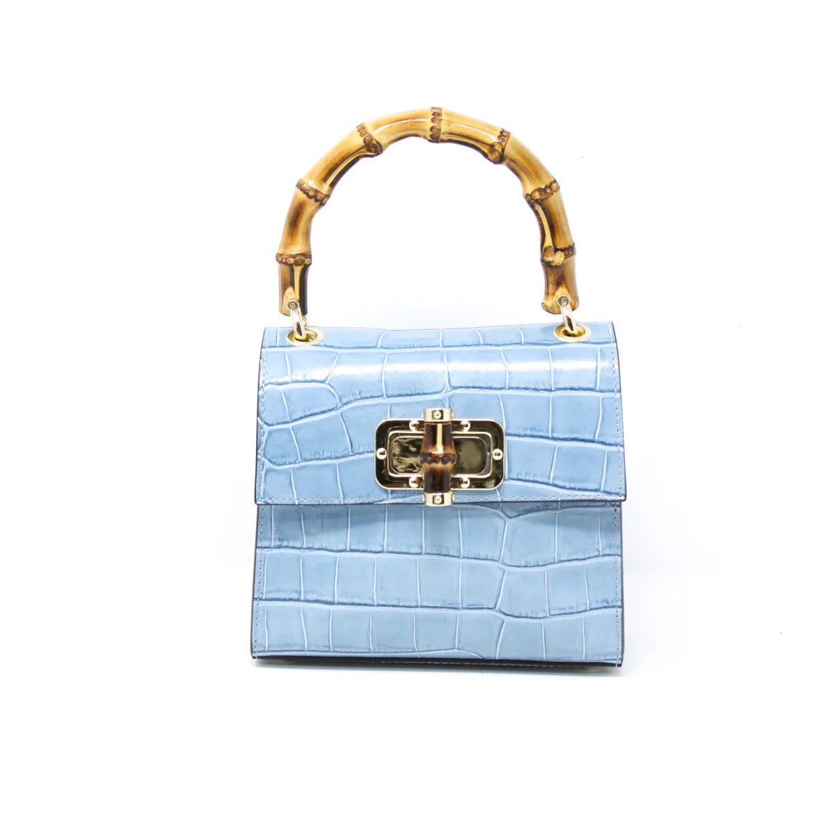A stylish light blue "Leather Bag With Bamboo Handle" made from Italian leather with a crocodile pattern and a gold clasp. The curved bamboo handle adds elegance, while the plain white background highlights its sophisticated design and rich texture.