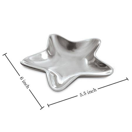 A shiny silver Aluminum Star Tray, designed in the shape of a star, is displayed with its dimensions marked: 6 inches from one star tip to the opposite and 5.5 inches between another pair of opposite tips. This food-safe tray features smooth, curved edges and a reflective surface, with hand wash recommended for optimal care.