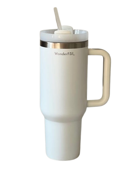 The Handled Tumbler White with Silver - 40 oz features "WanderFäll" near the top and offers double-wall vacuum insulation for excellent temperature retention. Constructed from BPA-free materials, this tall tumbler includes a handle on the right, a stainless steel rim, and comes with a lid and clear straw for enjoying both hot and cold beverages.
