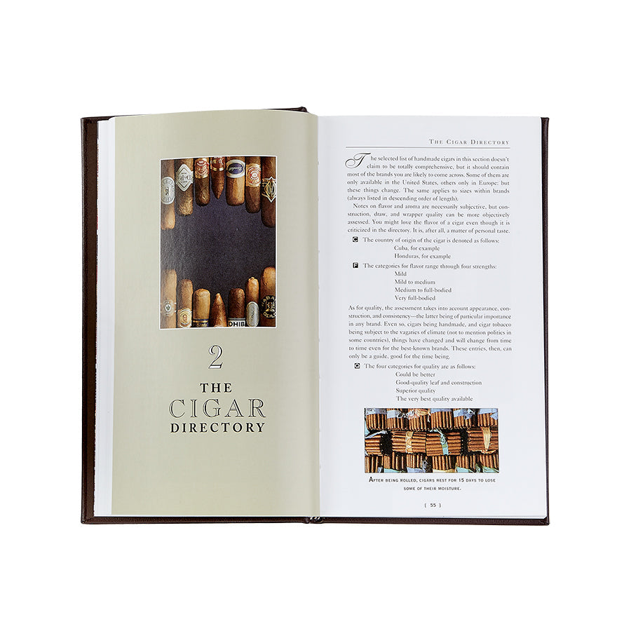 The Cigar Companion (Brown Bonded Leather) opens to pages 92 and 93, inviting cigar aficionados. The left page features a headline, "2 THE CIGAR DIRECTORY," above a photo of cigar ends. Meanwhile, the right page showcases text under "The Cigar Directory," accompanied by neatly arranged rows of handmade cigars pictured below, forming a visually structured layout.