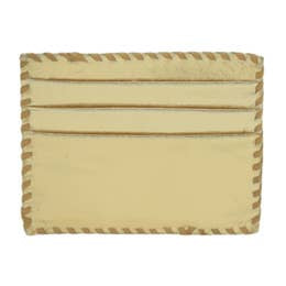 The Ivy Card Holder is a rectangular cardholder in beige, expertly handcrafted using cowhide hairon leather. It includes three horizontal slots set against a plain background. The edges display a two-tone striped pattern in beige and brown, further accentuated by intricate whipstitch detailing for an added decorative flair. Its design is simple yet functional.