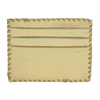 Introducing the Ivy Card Holder: a meticulously handcrafted accessory made from tan leather. It boasts stitched edges in a distinctive zigzag pattern, and features three horizontal card slots on one side. The smooth cowhide hairon leather retains its natural finish, enhancing the overall elegance of this design.