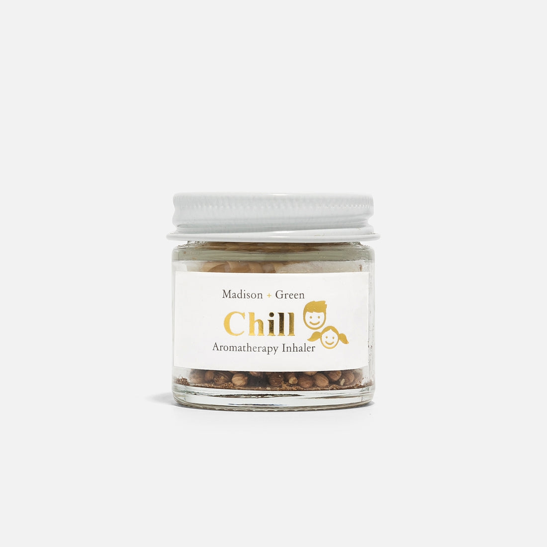 A small glass jar with a white lid, from the "Aromatherapy Inhalers - 13 varieties" line, contains stress-relieving scents made from organic essential oils. The label displays a yellow emoji-like smiling icon. This aromatic inhaler, presented on a plain white background, provides tranquility with each breath.