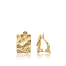 Load image into Gallery viewer, The Textured Elongated Clip-On Earrings feature a sleek rectangular shape with a dual texture design in 24 kt gold. One earring showcases a wavy texture, and from the side view, you can see the clip-on mechanism. These polished and shiny earrings exude an elegant and minimalist charm.
