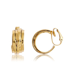 Load image into Gallery viewer, The Overlap Hoop Clip-On Earrings, featuring a gold-plated textured and layered design, exude retro charm. The left earring, shown closed from the front, complements the right earring, which is open to reveal its latch-back closure. Both earrings have a reflective surface and are set against a white background.
