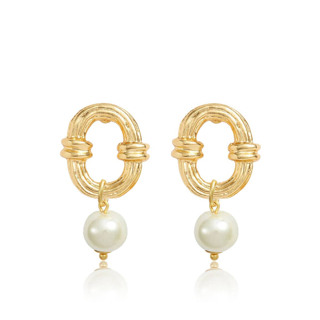 The Ornamented Link Earrings with Pearl Drop feature gold hoops adorned with a textured, oval-shaped design, interconnected by solid bands. These lightweight earrings are elegantly accentuated by a pearl drop at the base, enhancing their sophistication. The glossy pearls beautifully complement the shiny gold-plated finish of these exquisite earrings.