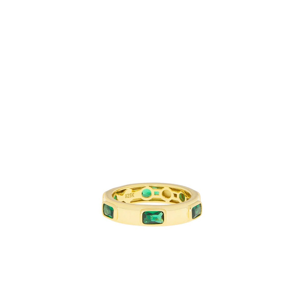 Introducing the Gold Plated Spaced Baguette Eternity Ring, featuring a series of five rectangular emerald green stones evenly spaced around the band. This statement piece is polished to a high finish and engraved with 