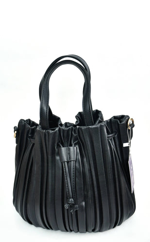 The Pleated Bucket Bag, crafted from black leather and adorned with a pleated design, is an ideal accessory for any occasion. It boasts two sturdy handles connected by metal rings and features drawstring details, along with a small tag on one handle. The bag is elegantly displayed against a plain white background.