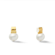 Load image into Gallery viewer, Introducing the Smooth + Classic Pebble Pearl Post Earrings, featuring exquisite round white pearls set in 14 karat gold backing. These elegant earrings boast a simple, classic design that beautifully highlights the lustrous pearls, each accentuated by a polished hypoallergenic gold clip. Displayed against a plain white background, they truly embody minimalist beauty.
