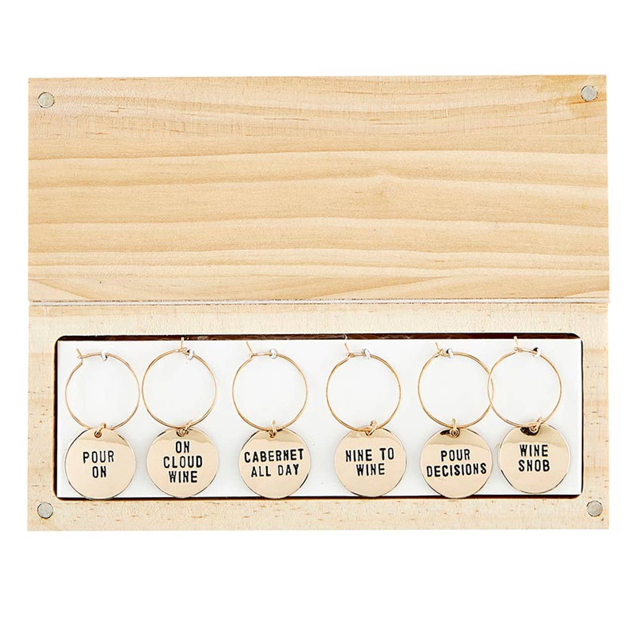 The Gold Wine Charms in Pine Box - Wine Tasting Daily set includes six wine glass tags with playful texts like "POUR ON" and "ON CLOUD WINE" arranged in a wooden frame with a hinged lid, perfect for gifts or adding festive flair to gatherings.