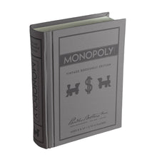 Load image into Gallery viewer, The Monopoly Vintage Bookshelf Edition, designed to resemble a vintage book, includes premium game components. This gray box adorned with black text and illustrations features train tokens and a dollar sign. Ideal for ages 8 and up and supporting 2 to 8 players, it is produced by Parker Brothers Inc.
