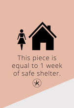 Load image into Gallery viewer, A minimalist design on a pink and gray background features black icons of a female figure and a house. Below, the text states, &quot;This piece is equal to 1 week of safe shelter.&quot; The composition is completed with an adjustable Ada Silver Heart Ring and a circular symbol with an X inside.
