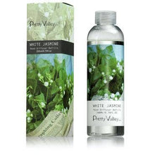 Load image into Gallery viewer, A bottle of Pretty Valley White Jasmine Diffuser Refill Oil stands next to its matching box, both decorated with blooming white jasmine flowers and green leaves. The clear bottle, which mirrors the box design, contains 200ml of liquid. Add a touch of Citrus Verbena for an invigorating twist to your fragrance experience.
