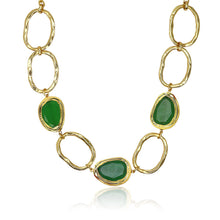 Load image into Gallery viewer, The Vivid Gems Trio Necklace, a true statement piece, features irregular gold chain links adorned with three striking green gemstones framed in gold. Its reflective finish exudes opulence and elegance, making it a standout addition to any jewelry collection against a white background.
