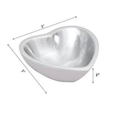 Load image into Gallery viewer, The Heart-shaped Bowl is a charming, shiny silver aluminum dish with a reflective surface. Measuring 3 inches in width and depth and 1 inch in height, its smoothly curved interior captures light elegantly, making it a perfect home decor piece.
