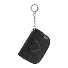 Load image into Gallery viewer, The Lovell Vegan Leather Card Holder is a small black pouch featuring a heart-shaped design on the front. It has a silver keychain with a chain link and ring attached to the top corner. With its curved right edge, this stylish accessory is perfect for holding small items or keys.
