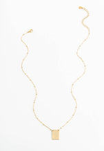 Load image into Gallery viewer, The It Is Well Necklace is an elegant piece crafted with 14K gold plating, showcasing a fine chain adorned with small round links and ending in a rectangular pendant. This necklace features engraved designs or text that represent faith and peace. Displayed flat against a white background, it comes with an adjustable clasp.
