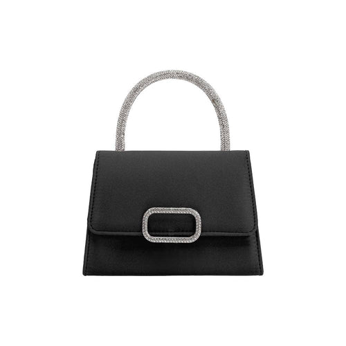 The Sadie Satin Top Handle Bag is a small, elegant, black handbag with a rectangular shape and flap closure, highlighted by a metallic buckle. Its silver crossbody strap adds shimmer and style to its minimalist design, making it both chic and functional.