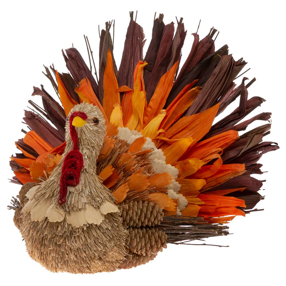 Introducing the Jerry Pinecone & Husk Thanksgiving Turkey, a charming decorative figurine crafted from natural materials, ideal for enhancing your tabletop decor. This piece features a textured body adorned with fibrous elements and a tail boasting vibrant feathers in shades of orange, red, and brown. Complete with its red wattle and small dark eyes, it beautifully captures the essence of festive autumn decoration.