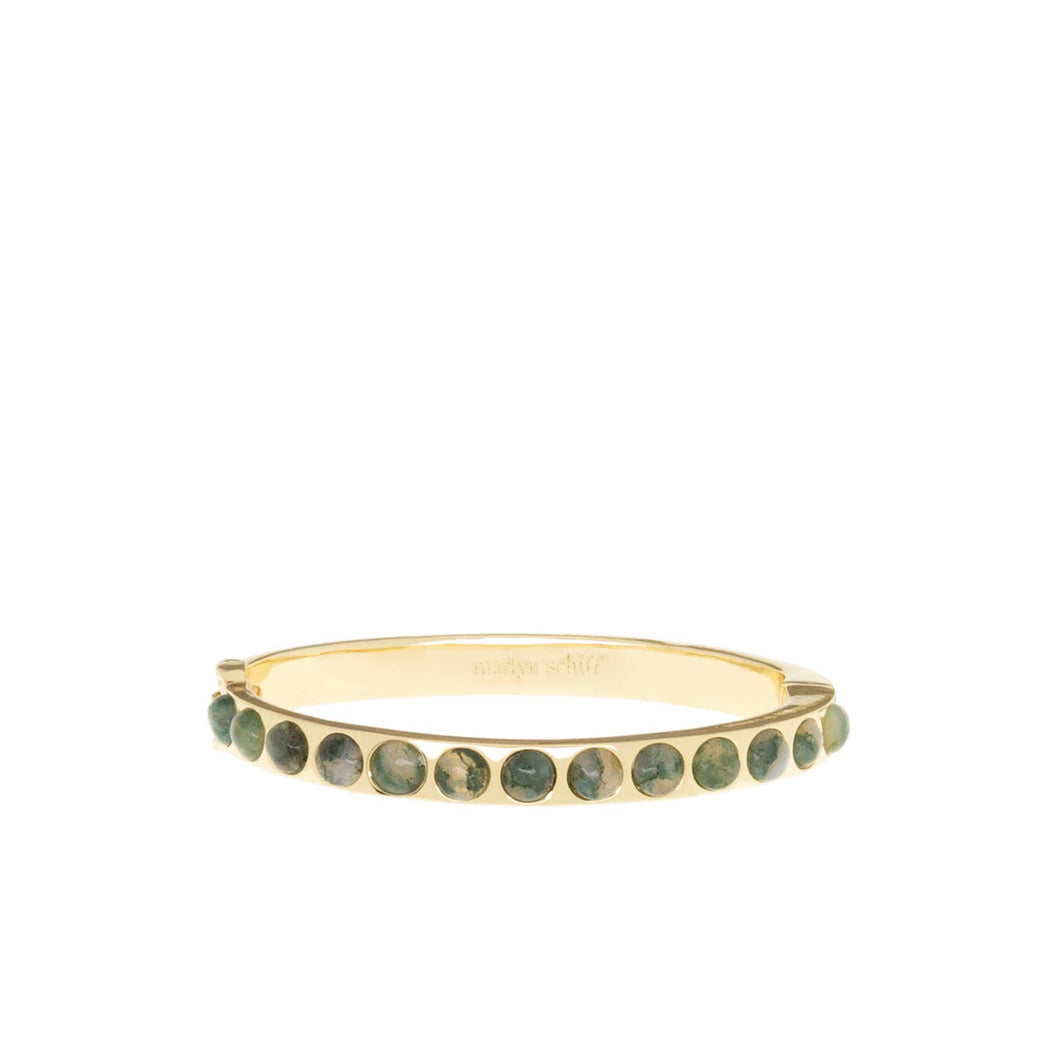 The Semi Precious Stone Bangle is a sleek and elegant hinged bracelet, adorned with evenly spaced round green semi-precious stones, encircling the wrist with a 6 1/4