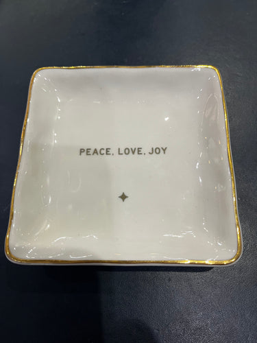 The Holiday Trinket or Soap Dish is a square, white keepsake dish with gold trim that displays the words 