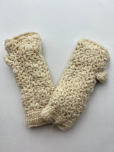 Load image into Gallery viewer, Presenting the cream-colored Wool Knit Fingerless Gloves, crafted from sheep wool with intricate flower patterns and a delicate crocheted texture on a plain white background. These gloves feature small, overlapping floral motifs, providing a cozy and decorative appearance. To ensure longevity, please hand wash only.
